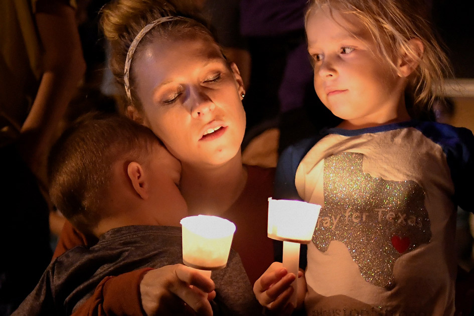 A woman and her children take part in a vigil for victims of a mass shooting in Sutherland Springs, Texas. A woman and her children take part in a vigil for victims of a mass shooting in Sutherland Springs, Texas.
